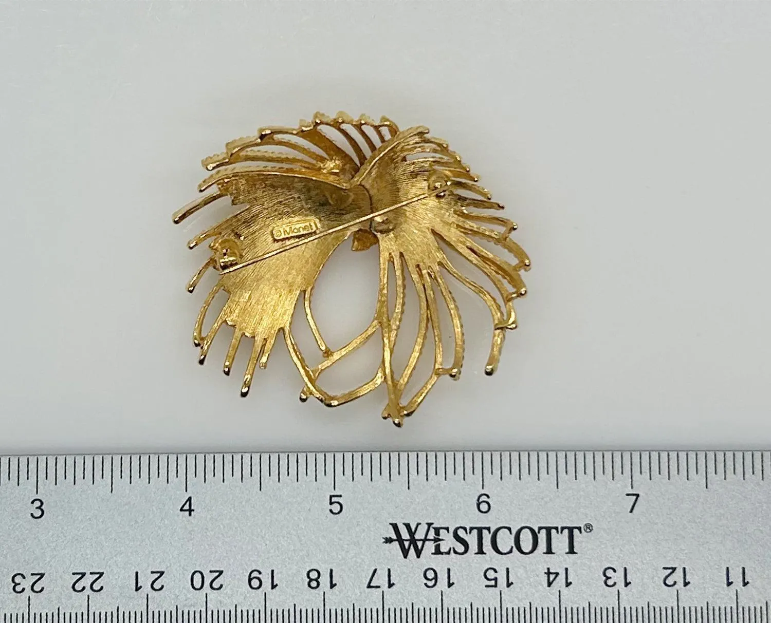 Monet  Vintage Gold Textured Tassel Pin